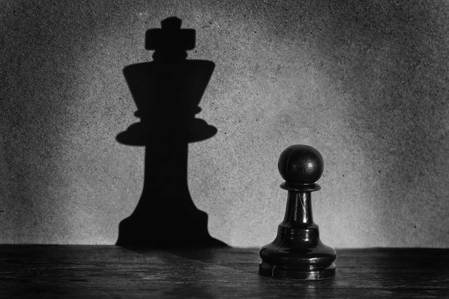 bigstock-Chess-Pawn-Standing-In-A-Spotl-60661814